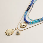 Layered Beaded and Pendant Necklace Set with Gold Accents | Heart and Charm Detail