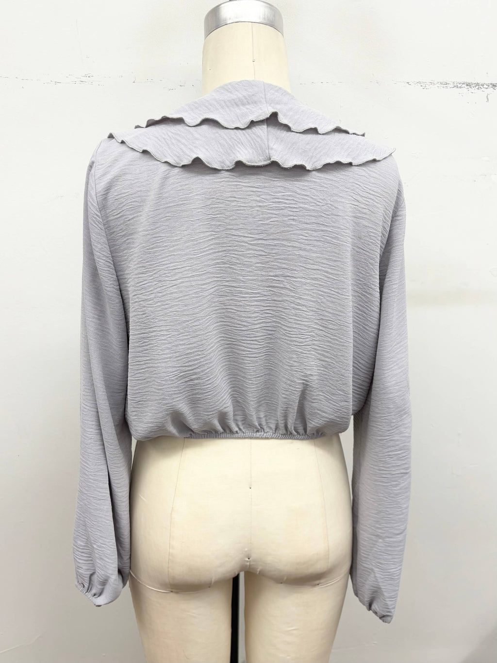 Ruffle Cascade V-Neck Blouse
