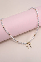 BOW RIBBON PEARL GOLD MIX CHAIN NECKLACE | 31N24093