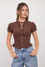 SMOCKED PEPLUM TIE NECK RUFFLED TOP
