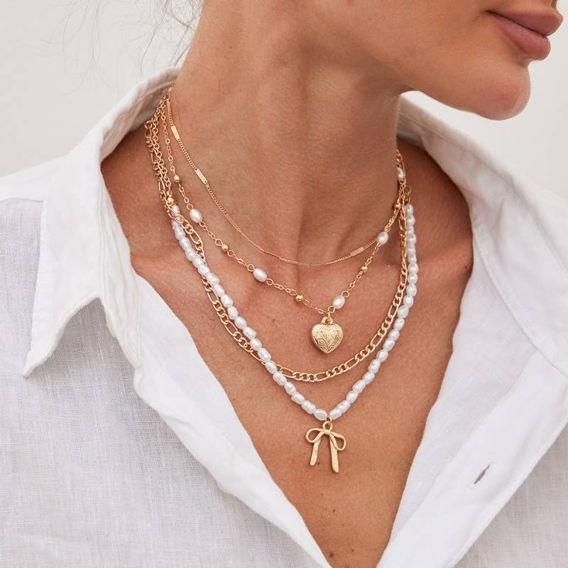 BEAUTIFUL BOW PEARL HEART PENDANT LAYERED NECKLACE |40NK9547