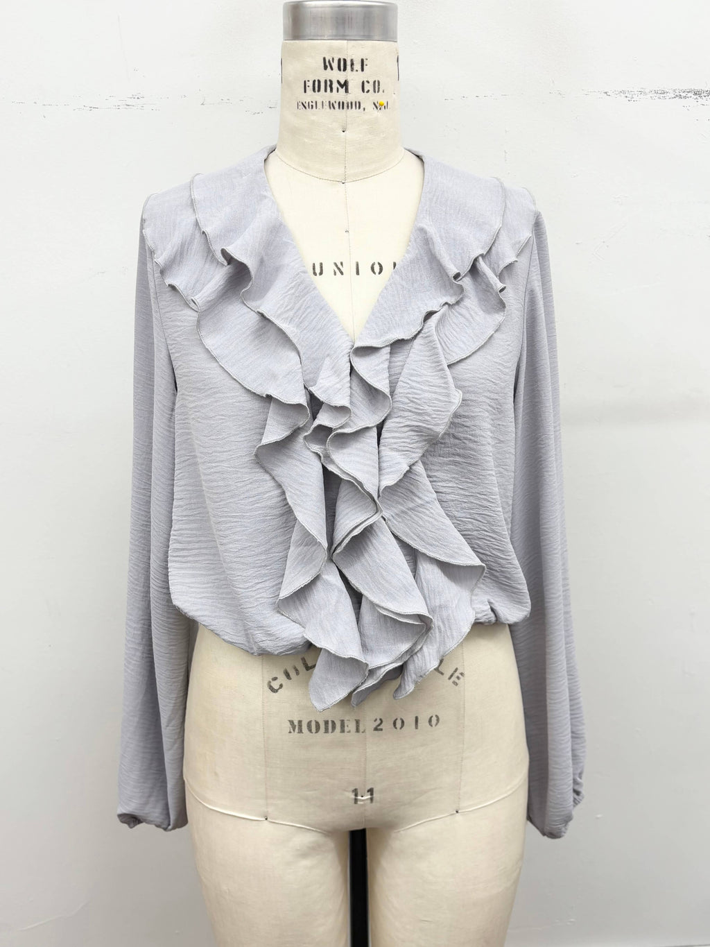 Ruffle Cascade V-Neck Blouse
