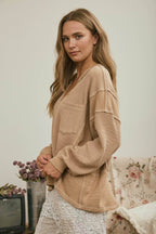 SPLIT NECK RAW EDGE LONG SLEEVE RIBBED KNIT TOP