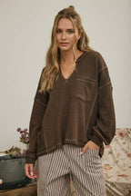 SPLIT NECK RAW EDGE LONG SLEEVE RIBBED KNIT TOP