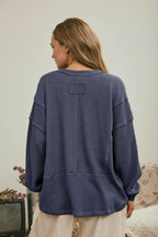 SPLIT NECK RAW EDGE LONG SLEEVE RIBBED KNIT TOP