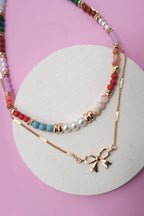 MULTI BEADED BOW CHARM DOUBLE LAYER NECKLACE | 80N91498