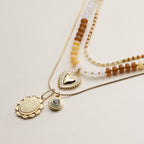 Layered Beaded and Pendant Necklace Set with Gold Accents | Heart and Charm Detail