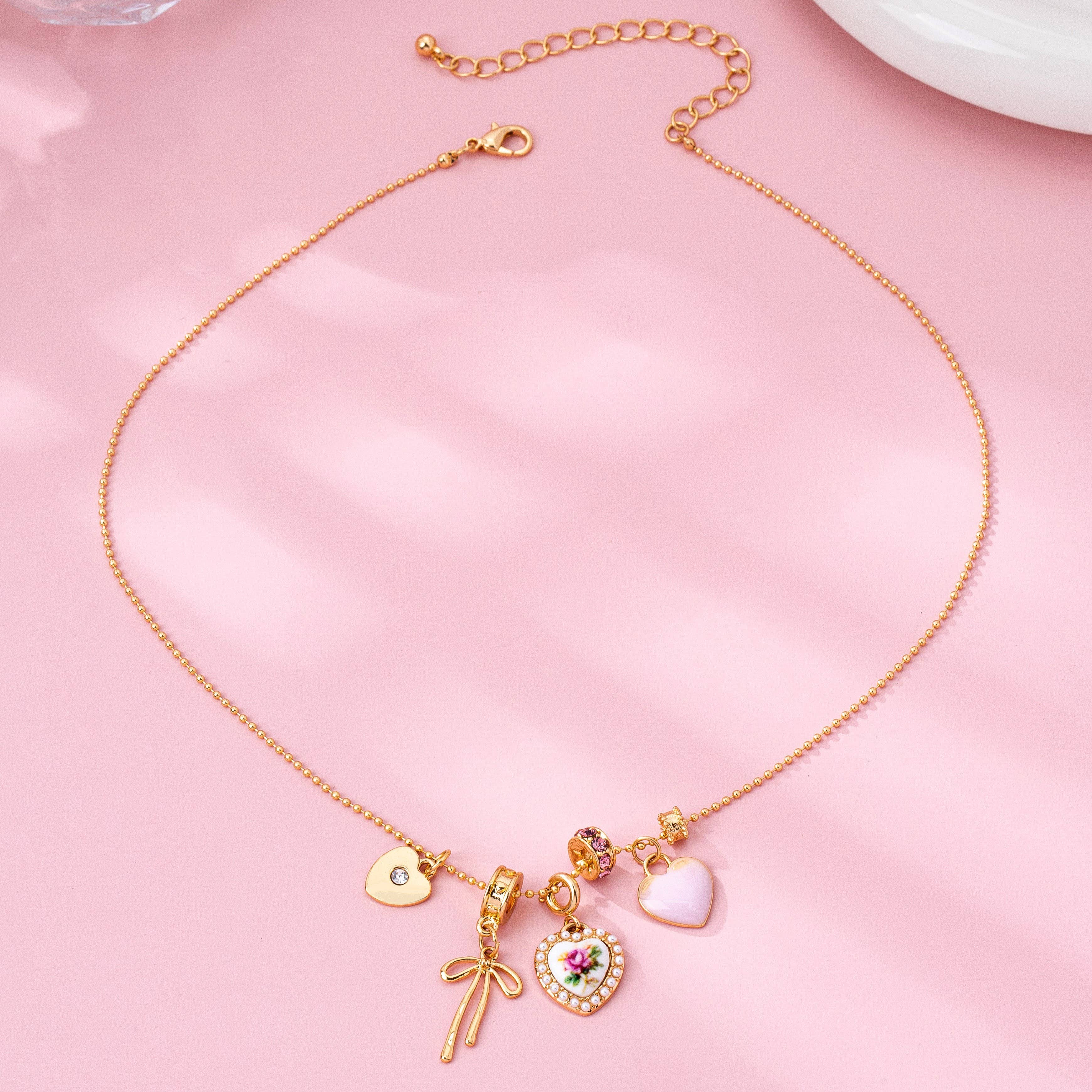Multi Charm Porcelain Bow Ball Chain Necklace | 80N92892