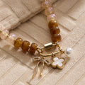 Textured Glass Bead Necklace with Charm Trio