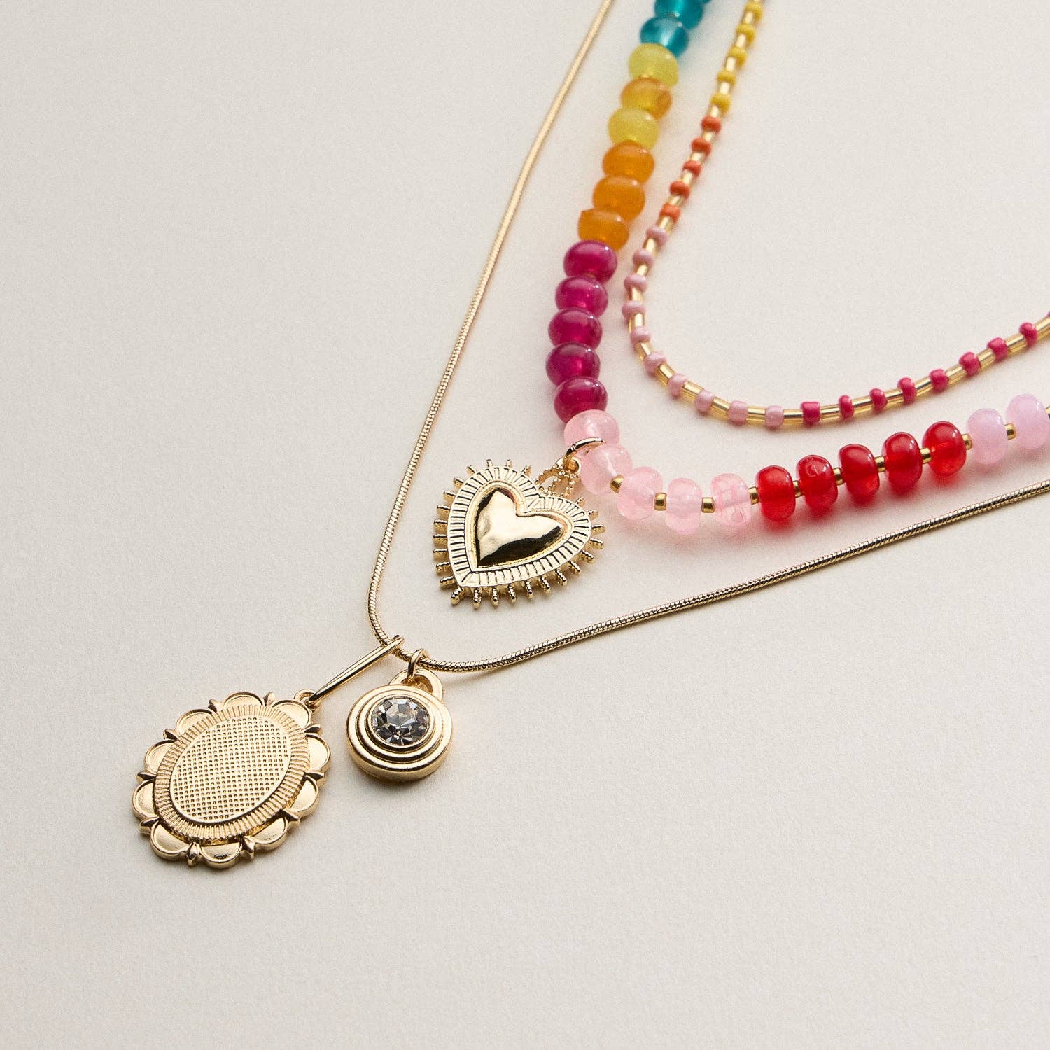 Layered Beaded and Pendant Necklace Set with Gold Accents | Heart and Charm Detail
