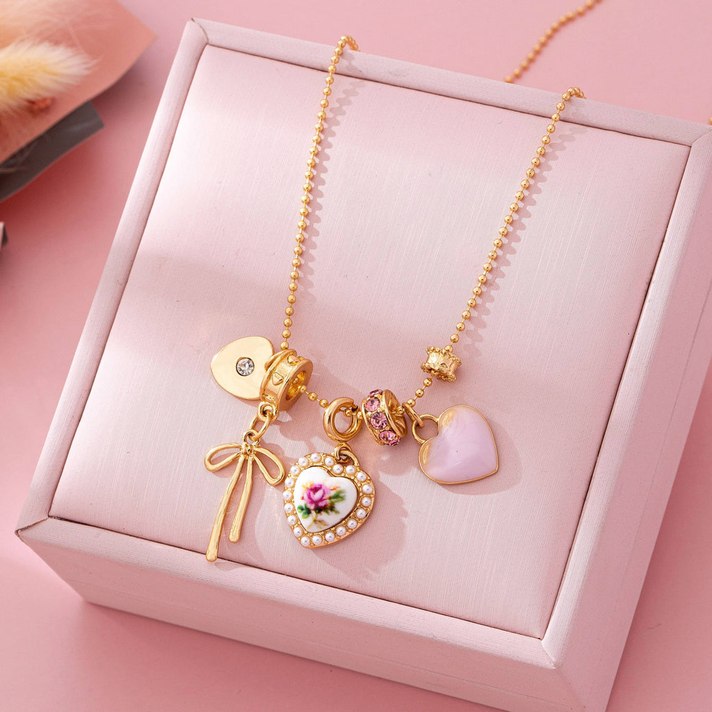 Multi Charm Porcelain Bow Ball Chain Necklace | 80N92892