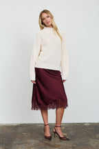 RIBBED ROLLED MOCK NECK CROPPED KNIT SWEATER