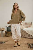 SPLIT NECK RAW EDGE LONG SLEEVE RIBBED KNIT TOP