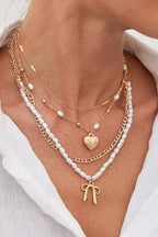 BEAUTIFUL BOW PEARL HEART PENDANT LAYERED NECKLACE |40NK9547
