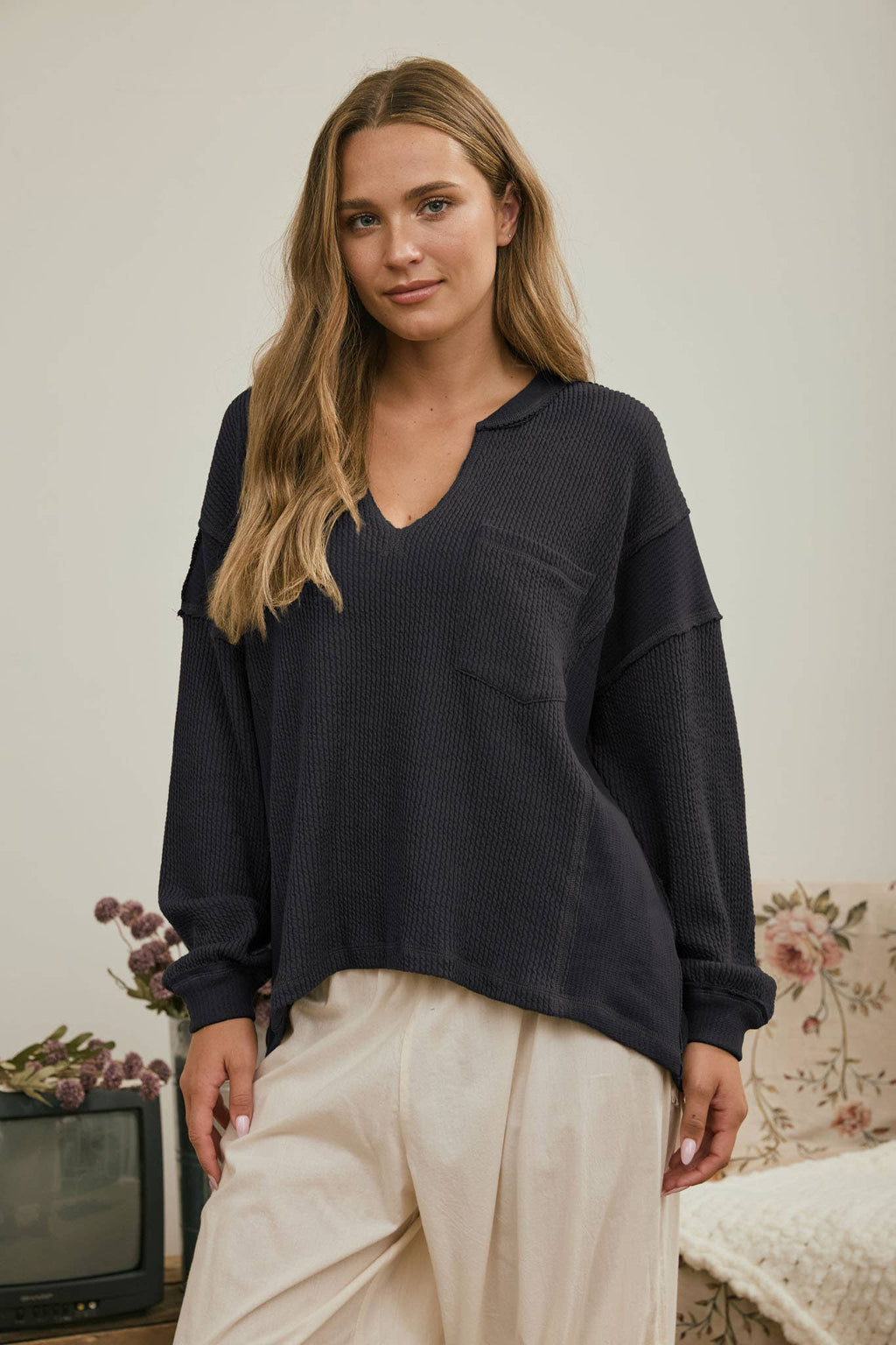 SPLIT NECK RAW EDGE LONG SLEEVE RIBBED KNIT TOP